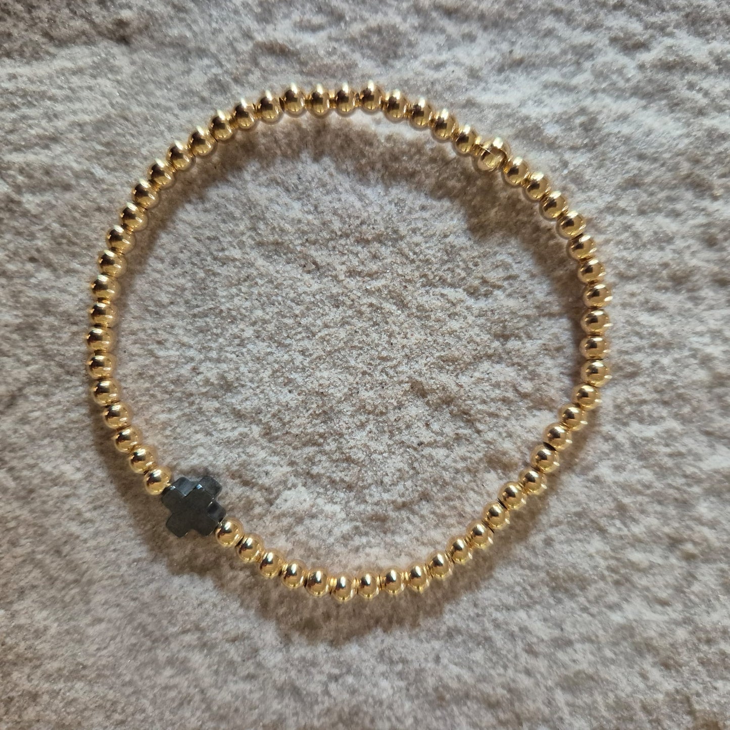 Pulsera Goldfilled y Cruz Hematite